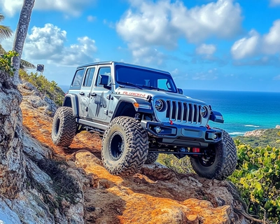 A picture of my Jeep Wrangler Rubicon 2024 4XE off-roading climbing a hill with a breath-taking view at the top of the hill. My Jeep has a 4 1/2 lift kit and 37 inch tires.